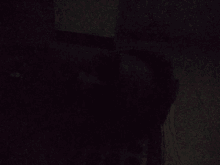 a dark room with a few lights on the wall
