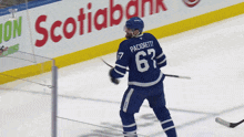 a hockey player wearing a jersey with the number 67 on it
