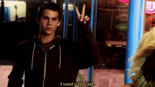 a man is giving a peace sign and saying i want a blowjob .