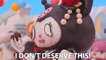 a stuffed animal with the words i don t deserve this on it