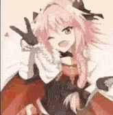 a girl with pink hair is giving a peace sign while sitting on a chair .