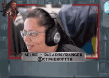 a woman wearing headphones is named selise paladin/ranger