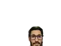 a man wearing glasses and a beard looks at the camera