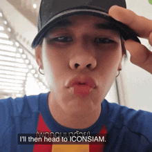 a man wearing a hat and a shirt that says ' i 'll then head to iconsiam ' on the bottom