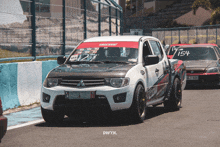 a race car with the number 154 on the front
