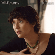 a close up of a woman 's face with the words wild cards behind her