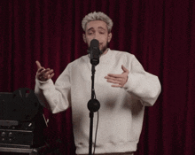 a man singing into a sony microphone