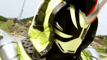 a close up of a person wearing a helmet with the letter o on it