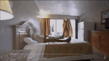 a person laying on a bed in a hotel room with a 10 seconds timer