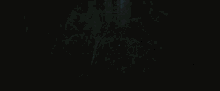 a person riding a motorcycle on a dark road