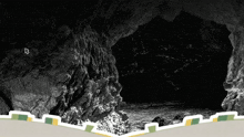 a black and white photo of a cave with a white arrow pointing to the exit