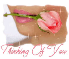 a picture of a woman holding a rose in her mouth with the words thinking of you