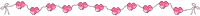 a row of pink hearts on a string on a white background
