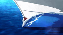a white sailboat is floating on top of a blue water surface
