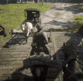 a man is riding a horse drawn carriage over a bridge