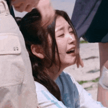 a woman is being comforted by a man while crying