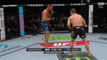 two men are fighting in a ufc ring with thorne on the corner