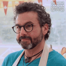 a man with glasses and a beard is on a great canadian baking show