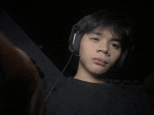 a young man wearing headphones and a microphone