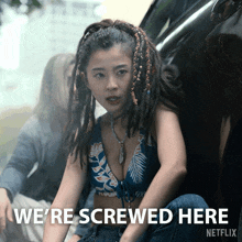 a woman with dreadlocks sits in the back of a car and says we 're screwed here netflix
