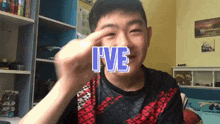 a young boy is making a funny face with the word i 've written on his face