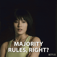 a woman in a yellow tank top with the words majority rules right on the bottom