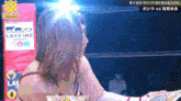 a woman in a boxing ring with a sign that says ' laffine group ' on it