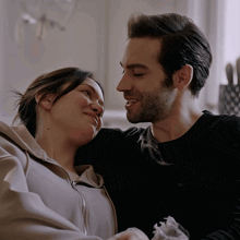 a man and a woman are looking into each others eyes