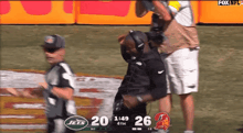 a football game between the jets and the buccaneers is being broadcast on fox nfl
