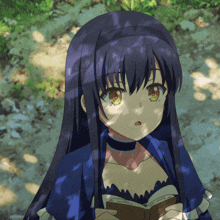 a girl in a blue dress is reading a book