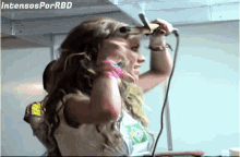 intensos por rbd is written on the bottom of a photo of a woman