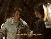 a man in a nasa uniform talks to a woman