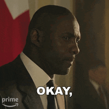 a man in a suit and tie is asking the question questions