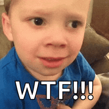 a young boy is making a funny face and saying wtf !!!