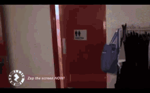 a red door with a sign on it that says men 's restroom
