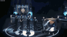 a group of people holding a korean flag in front of a g2 esports sign