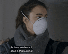 a woman wearing a face mask is asking if there is another unit open in this building