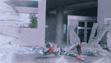 a person is laying on the ground in front of a building with a sign that says ' a ' on it