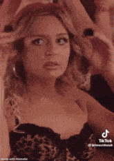 a woman in a leopard print bra has a tik tok made with mematic