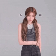 a woman in a plaid tank top and black jeans