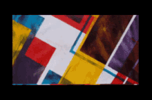 a black background with a colorful pattern of squares