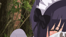 a girl is blowing her nose with a tissue