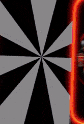 a black and white striped background with a red circle in the center