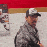 a man wearing a hat that says cleveland