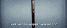 a man is peeking out of a door with the words `` im great darling hope you are too '' written on it .