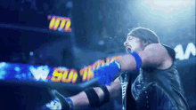 a wrestler in a ring with a sign that says wtl