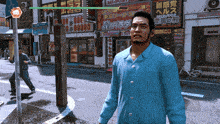 a man in a blue shirt is walking down a street in front of a sign that says ' 100000 ' on it
