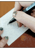 a person is writing on a piece of paper with a pen that has a barcode on it that says lsn16014