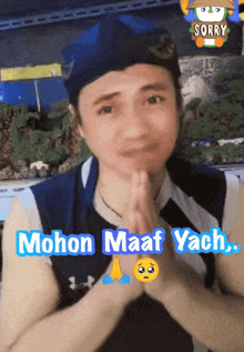 a man with his hands folded and the words mohon maaf yacht
