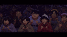 a group of people are watching a game and the words in the balls are on the screen